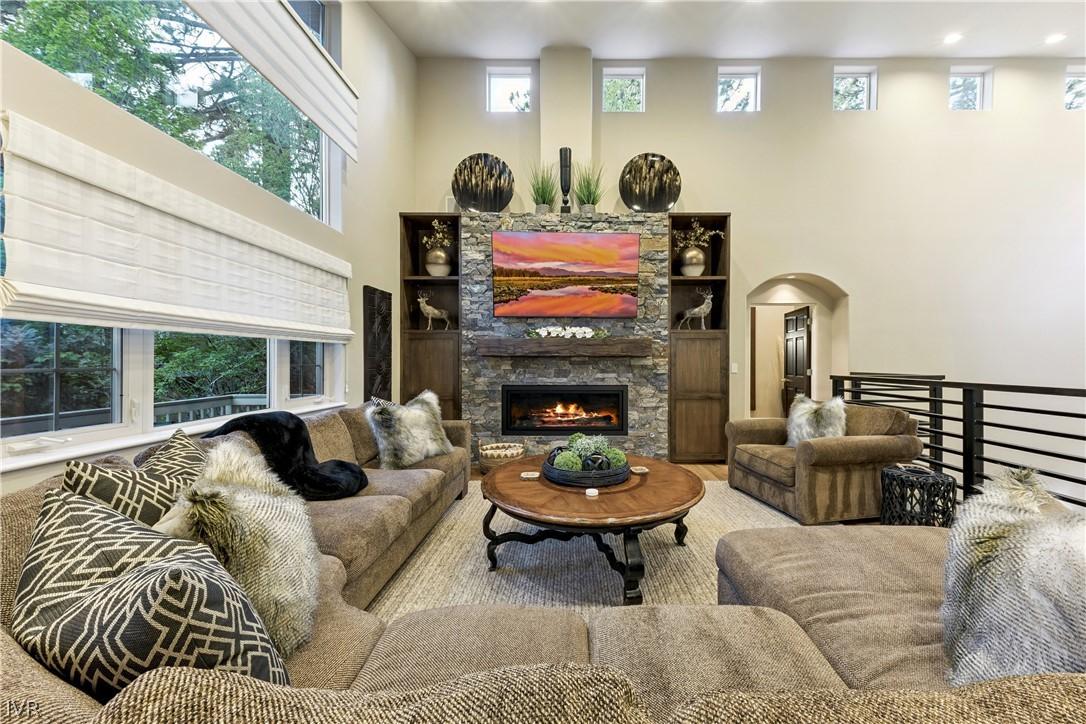 Image 3: Spacious great room with soaring ceilings that flo