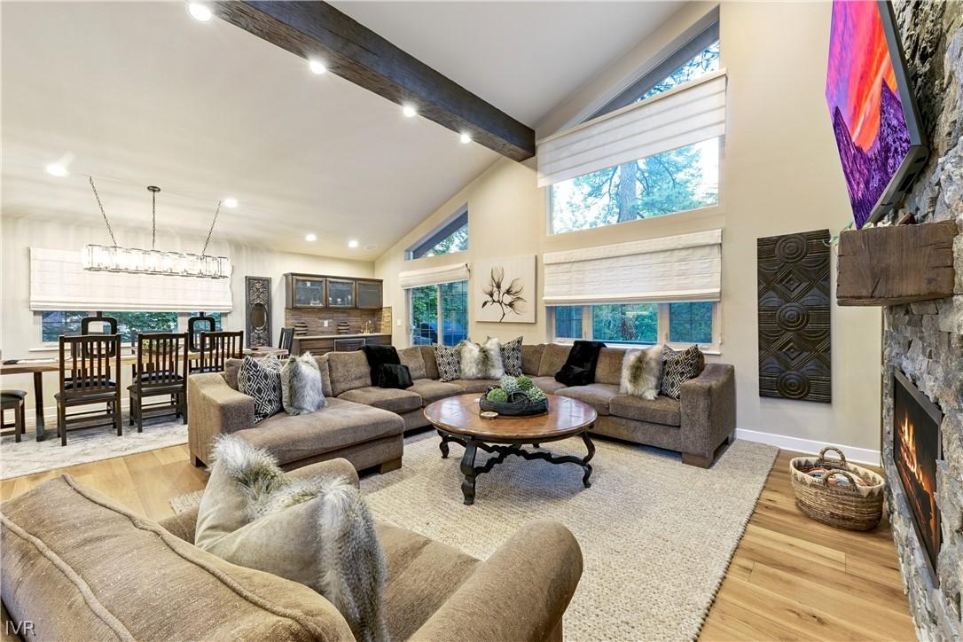 Image 4: Spacious great room with soaring ceilings that flo
