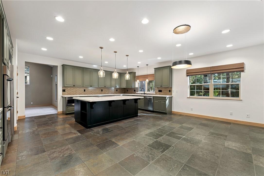 Image 2: Beautifully remodeled kitchen offers abundant cabi