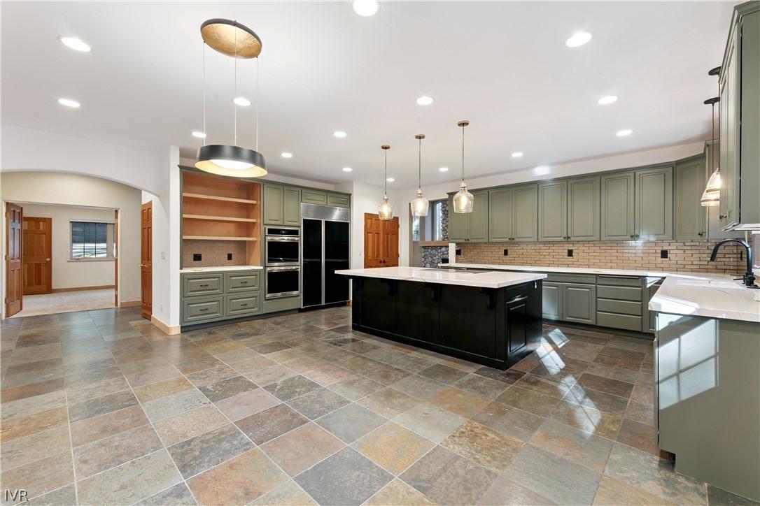 Image 3: Beautifully remodeled kitchen offers abundant cabi