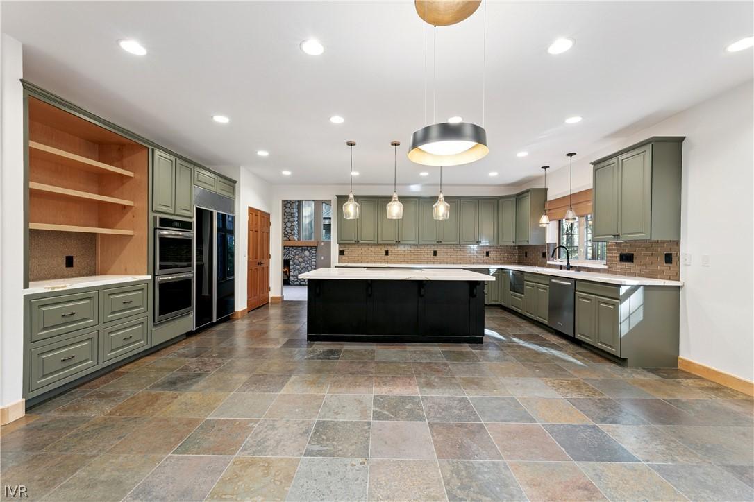 Image 4: Beautifully remodeled kitchen offers abundant cabi