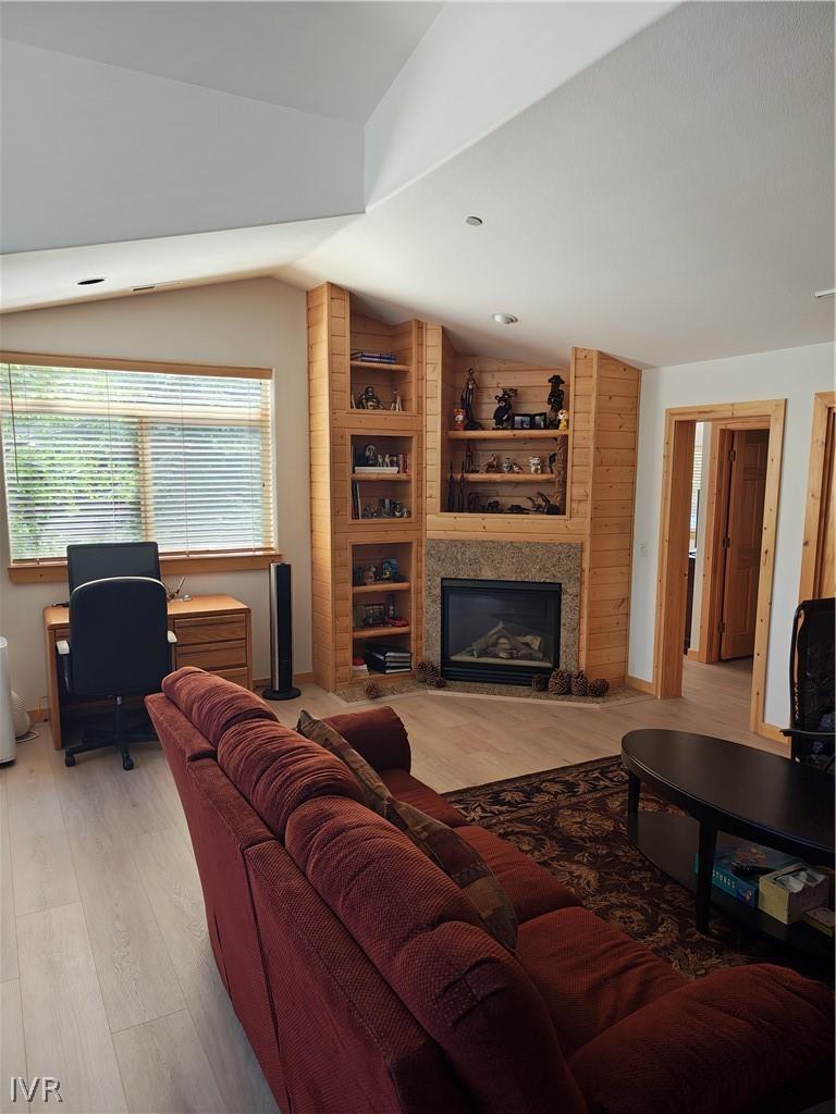 Image 2: Living room with fireplace and doorway leading to