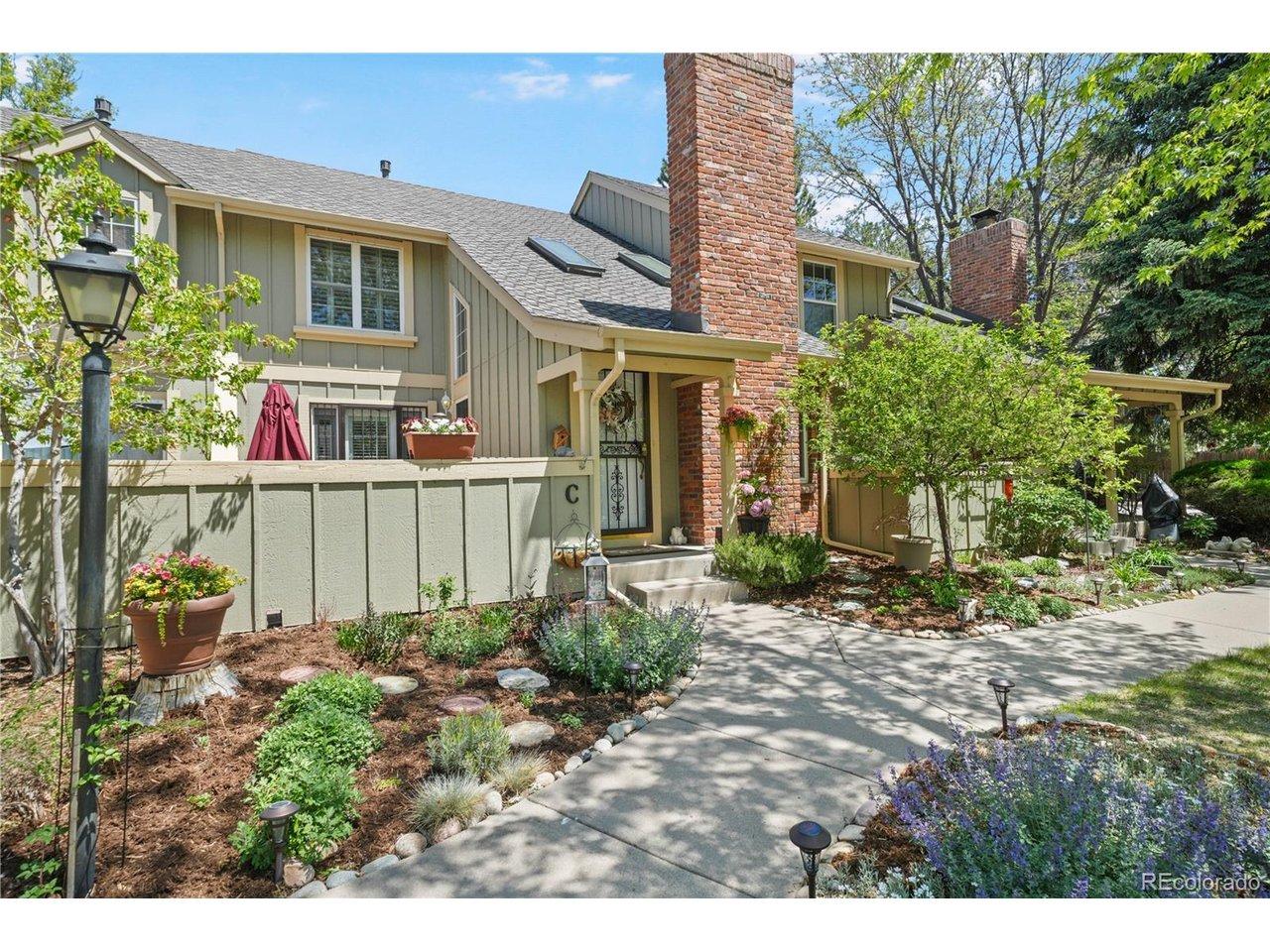 Image 2: Lush landscaping and a beautiful brick chimney welcome you to this special home!