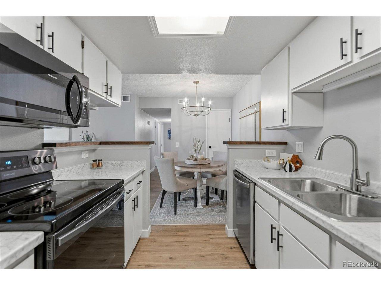 Image 2: Professionally painted cabinets, with new counter top, and newer appliances. Image 2: Professionally painted cabinets, with new counter top, and newer appliances.