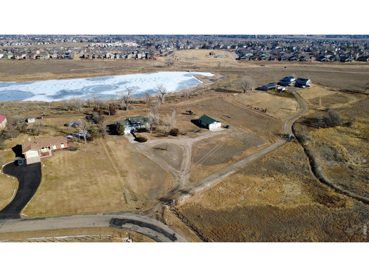 Image 1: Surrounded by nature, this lovely acreage is your getaway without the rural drive time!