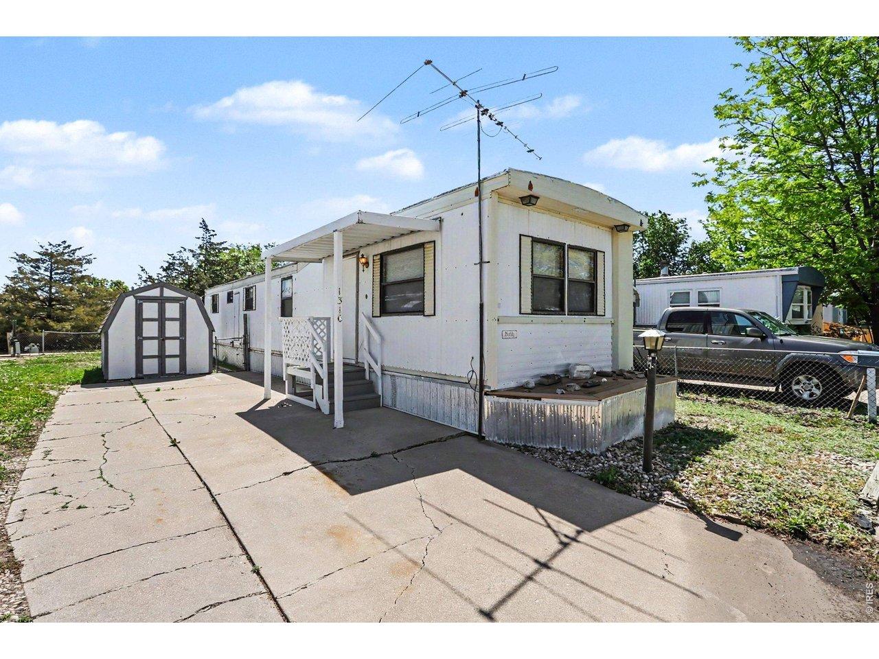 Image 1: Covered Entryway; Ample Parking; Storage Shed included Image 1: Covered Entryway; Ample Parking; Storage Shed included