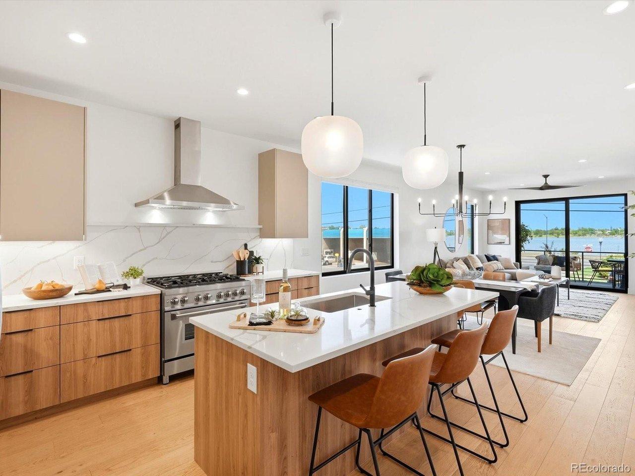 Image 2: Main Living Kitchen, Dining, Living and Patio all with Incredible Lake Views Image 2: Main Living Kitchen, Dining, Living and Patio all with Incredible Lake Views