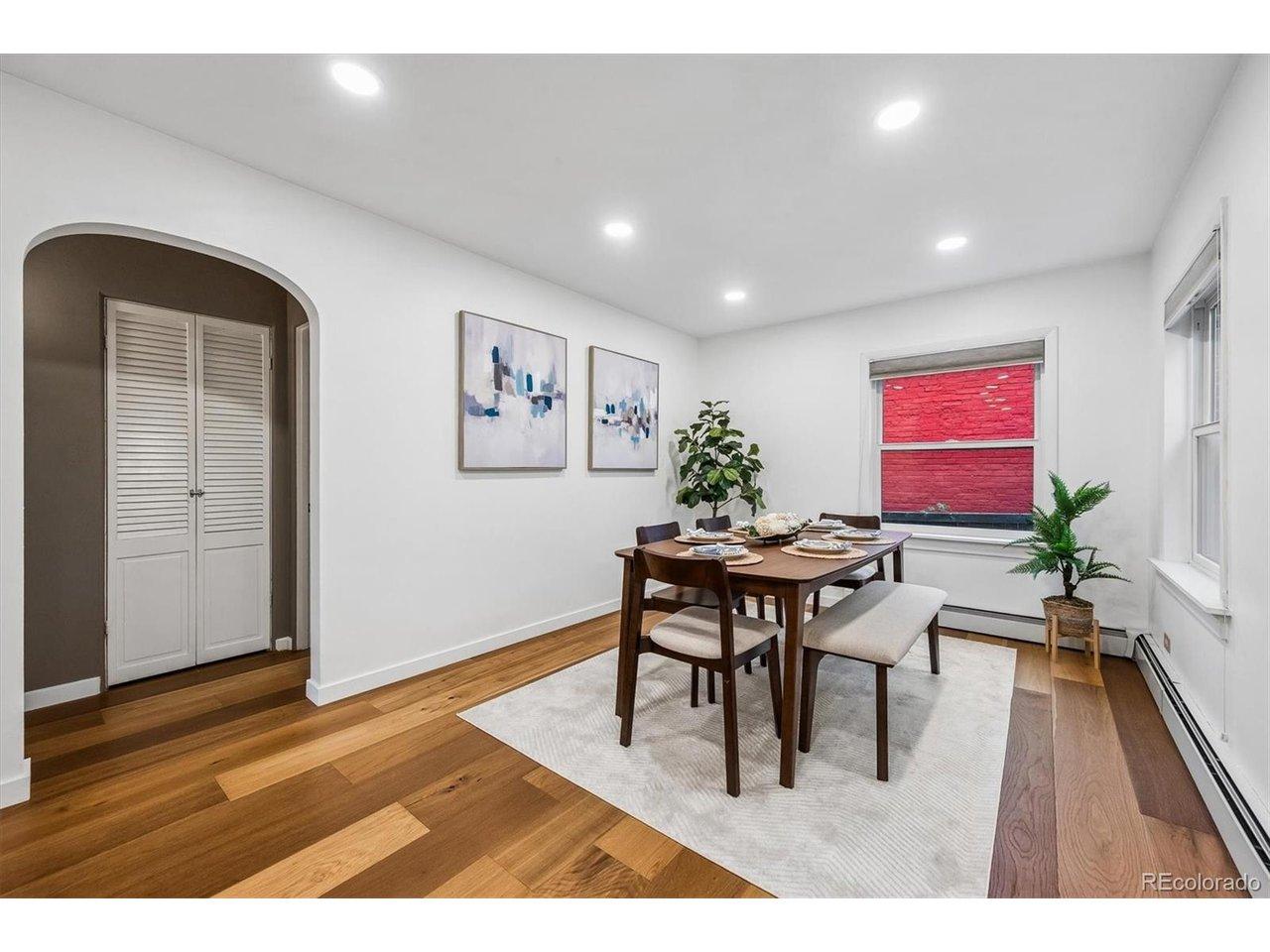Image 4: Light-filled dining room with hardwood floors and a functional layout. Image 4: Light-filled dining room with hardwood floors and a functional layout.