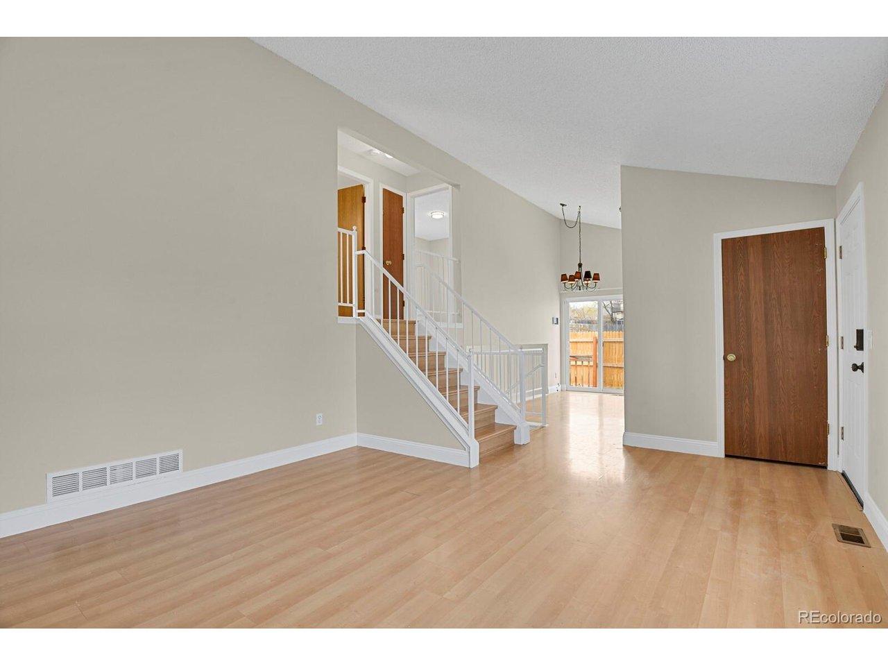 Image 3: Living Room with Vaulted Ceilings