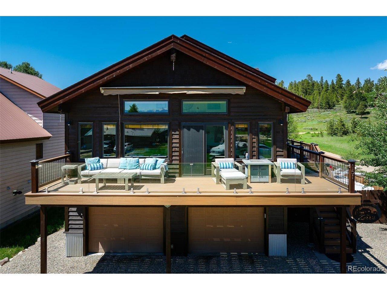 Image 1: front of home featuring large wrap around deck