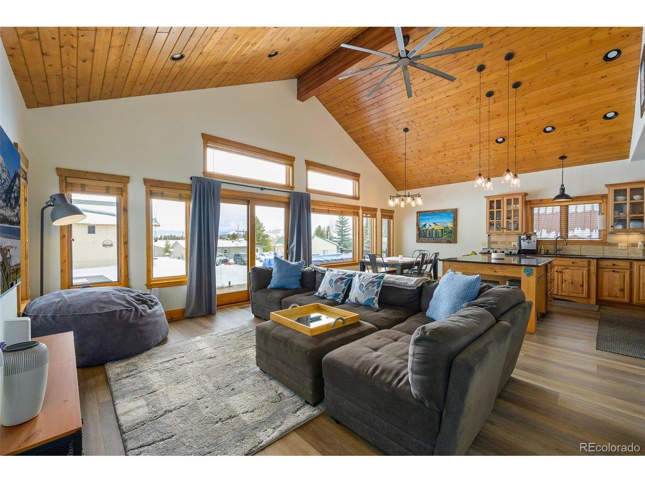 Image 2: open living room with vaulted ceilings