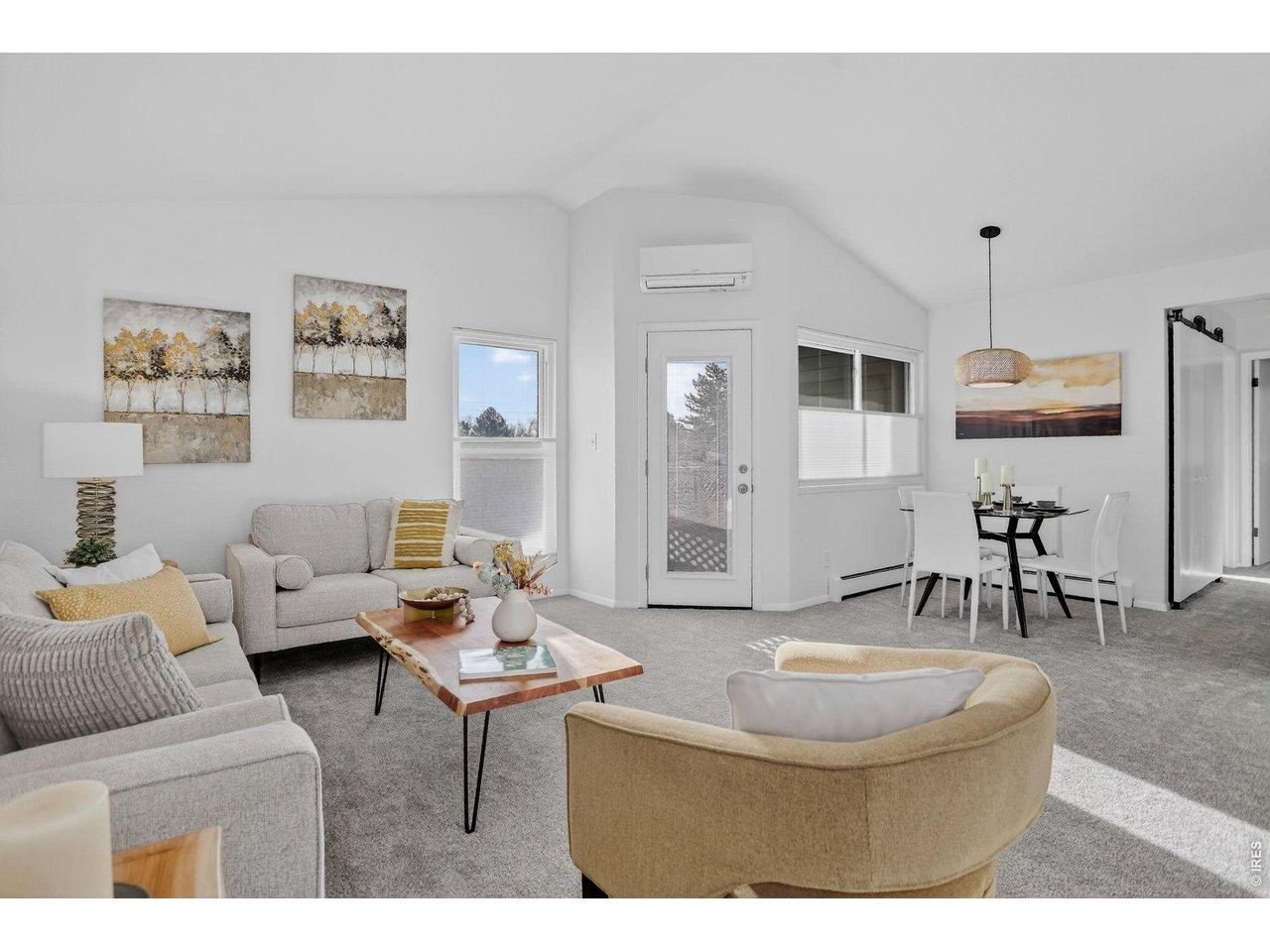 Image 4: Open concept living space with vaulted ceilings offering natural light