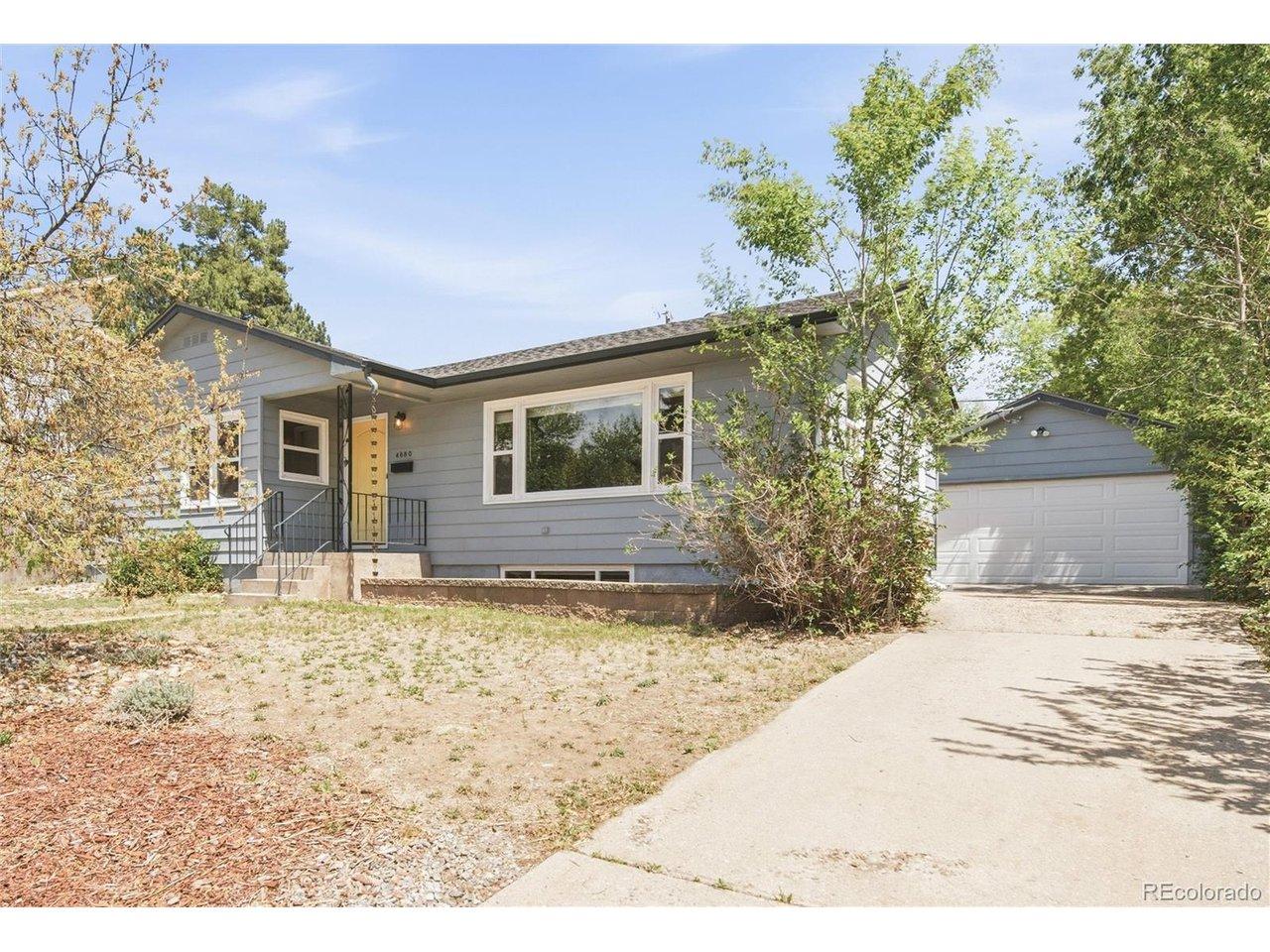 Image 2: How cute is this house? Xeriscaping and a yellow door! Two car garage down the driveway. Room for SO MANY cars!
