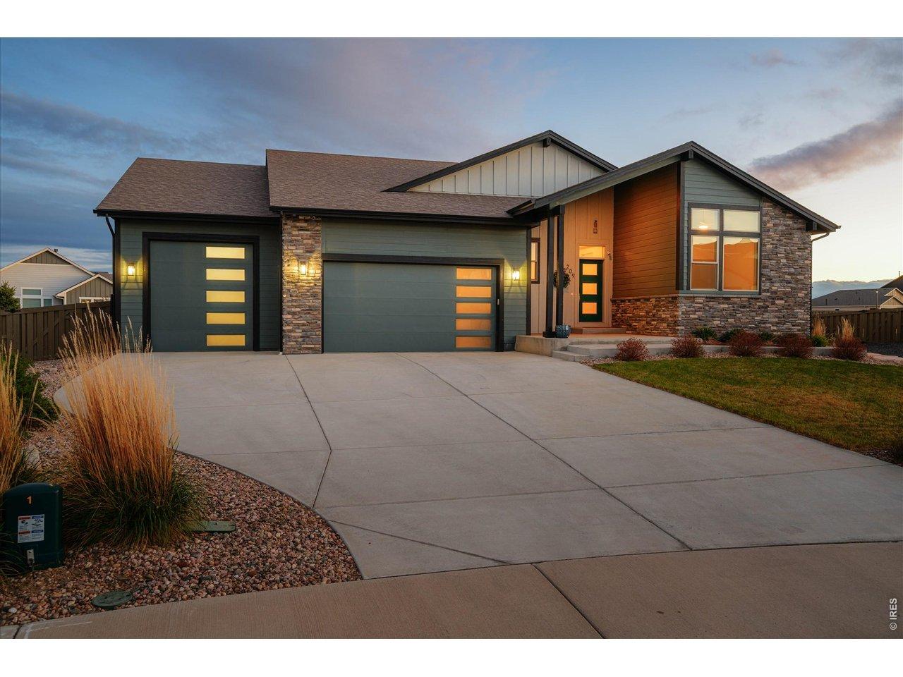 Image 1: Welcome to 209 Silo Ct, Severance, Colorado-an exceptional half-acre luxury home featuring mountain views, a 39' RV garage, and over 4,100 sq ft of refined ranch-style living.