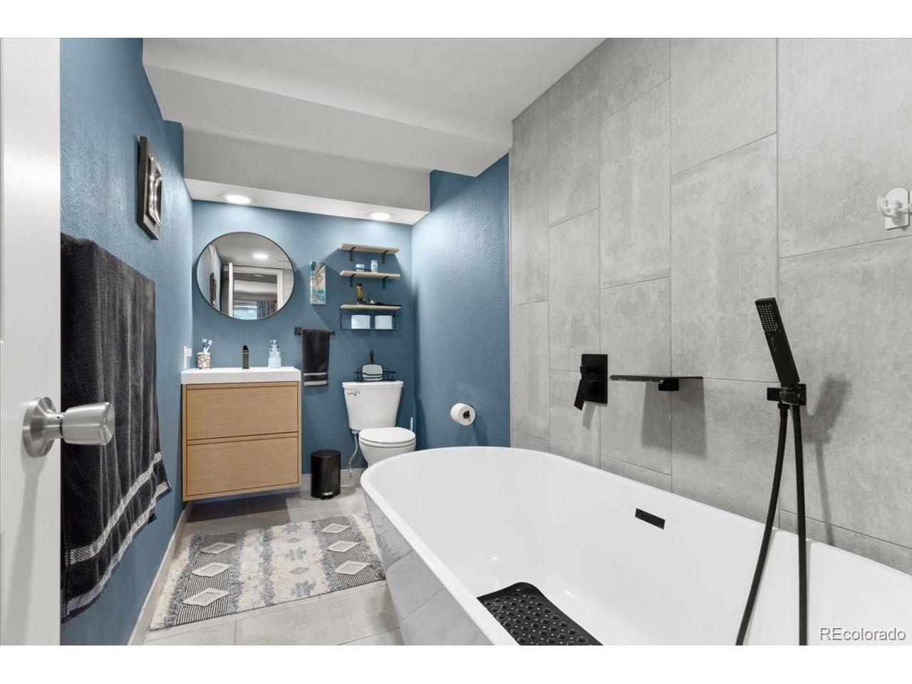 Image 4: Imagine relaxing in the soaking tub or a special bath time spot for kiddos.