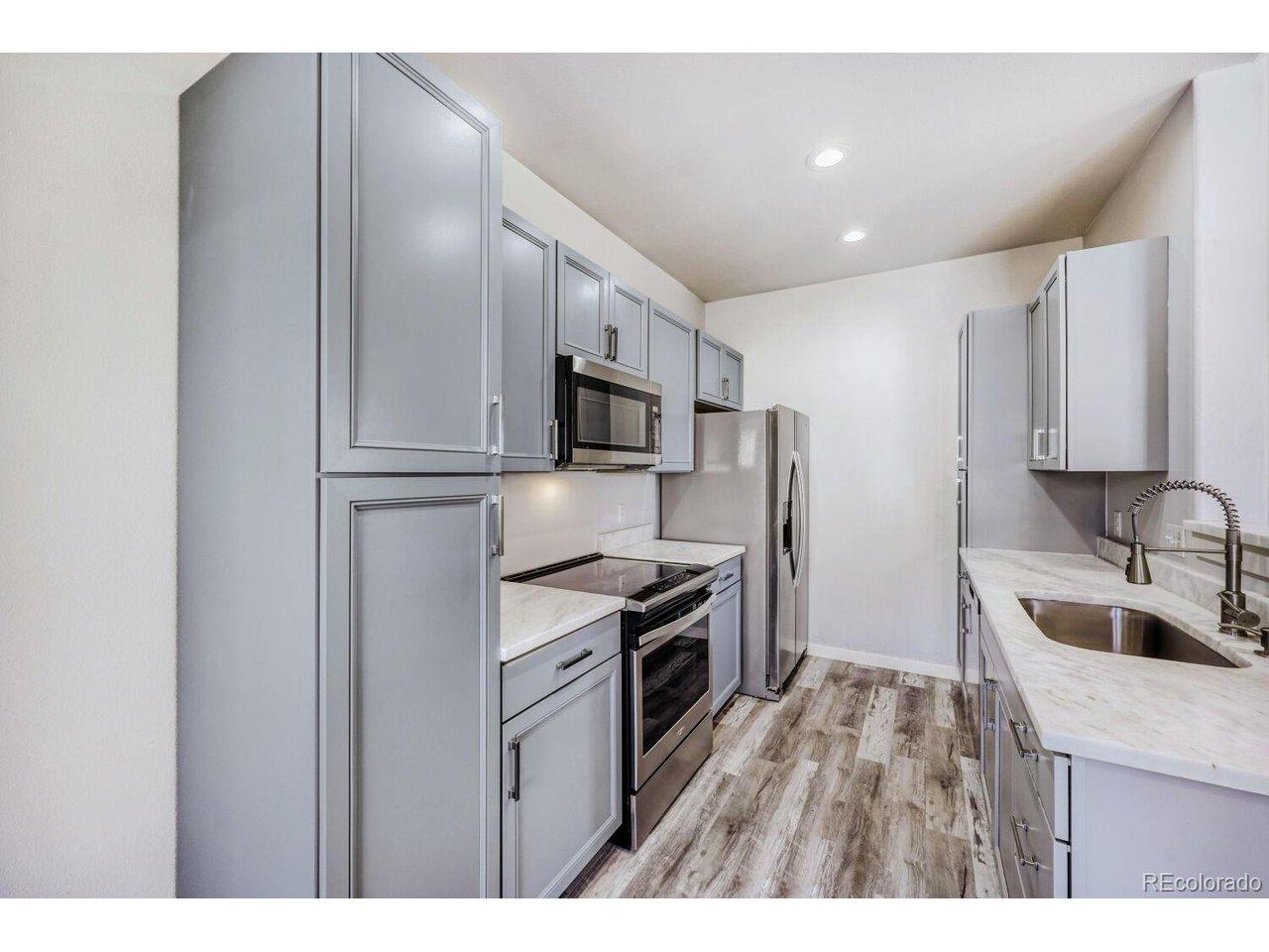 Image 3: Newer appliances, cabinets and white marble countertop Image 3: Newer appliances, cabinets and white marble countertop