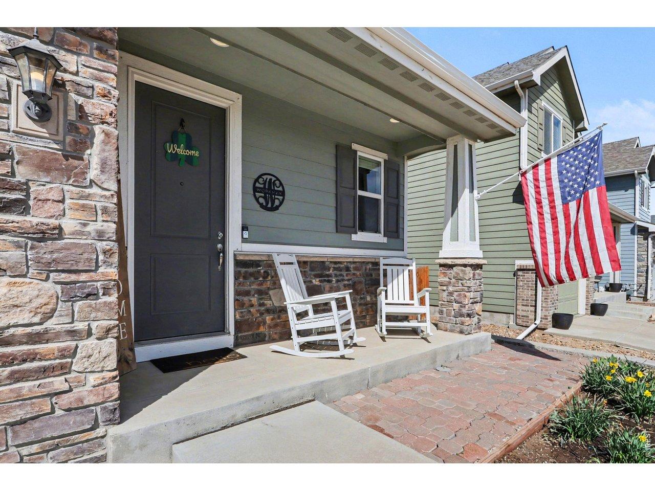 Image 2: Covered front porch, perfect for morning coffee and evening sunsets- the most charming entry to your new home!