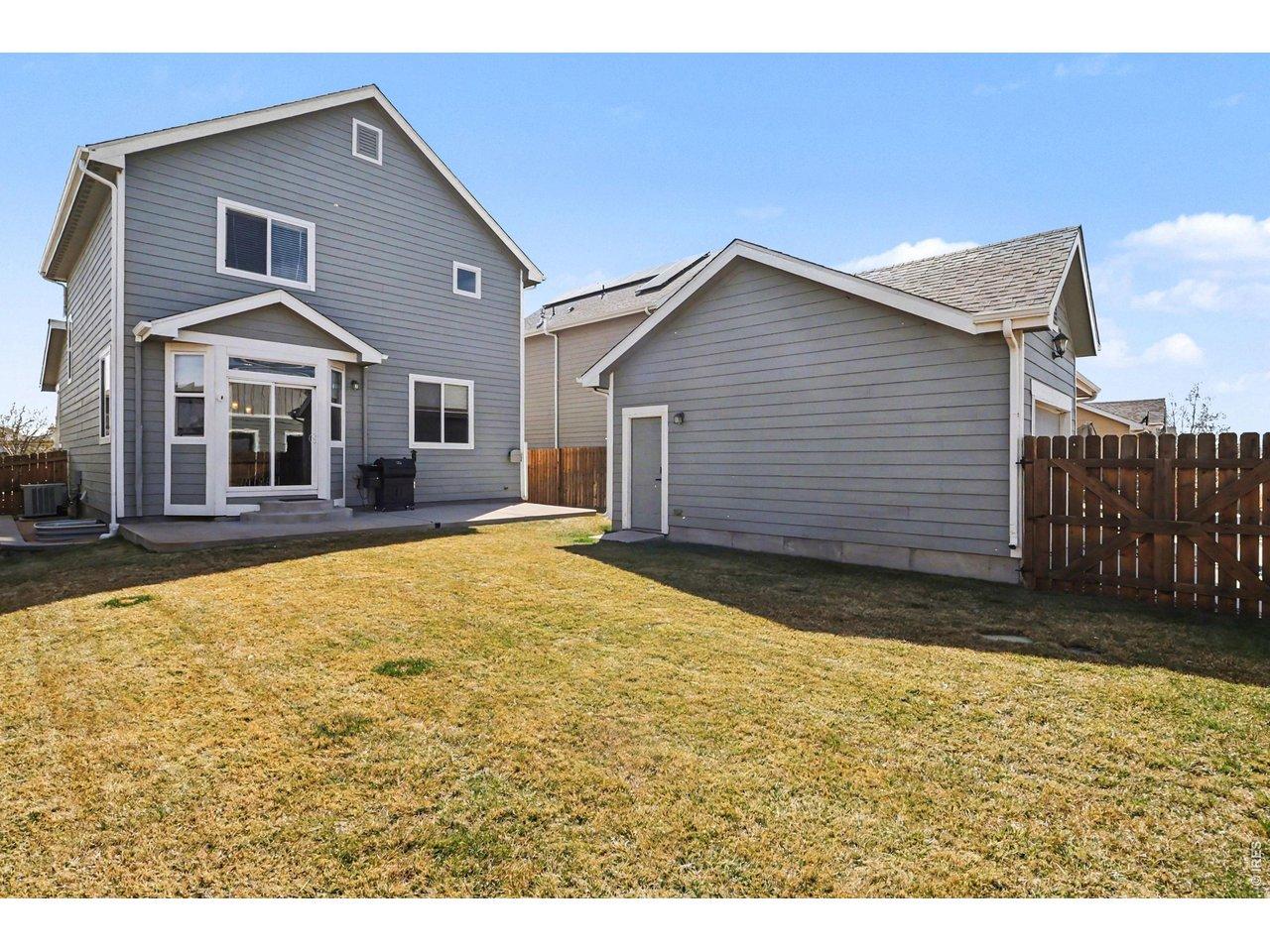 Image 3: Full privacy fence, amazing yard, and patio access all make the PERFECT yard for entertaining or family time!