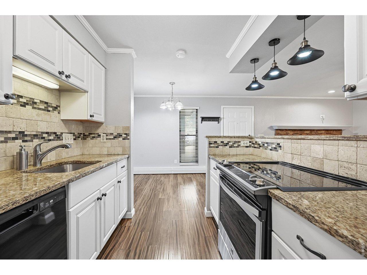 Image 3: Kitchen view to dining area
