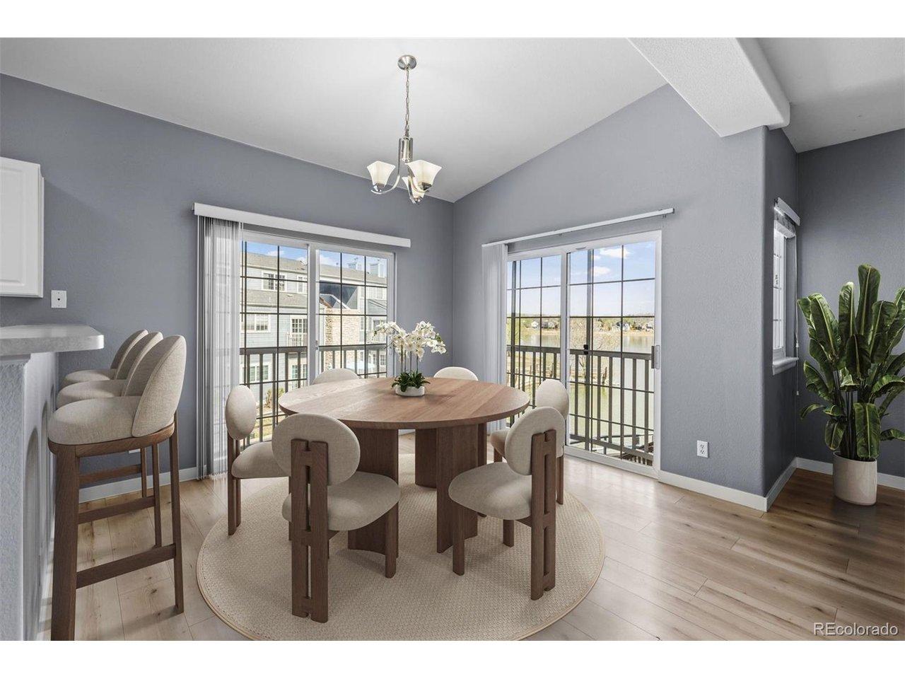 Image 2: Dining room overlooking the lake (virtually staged)