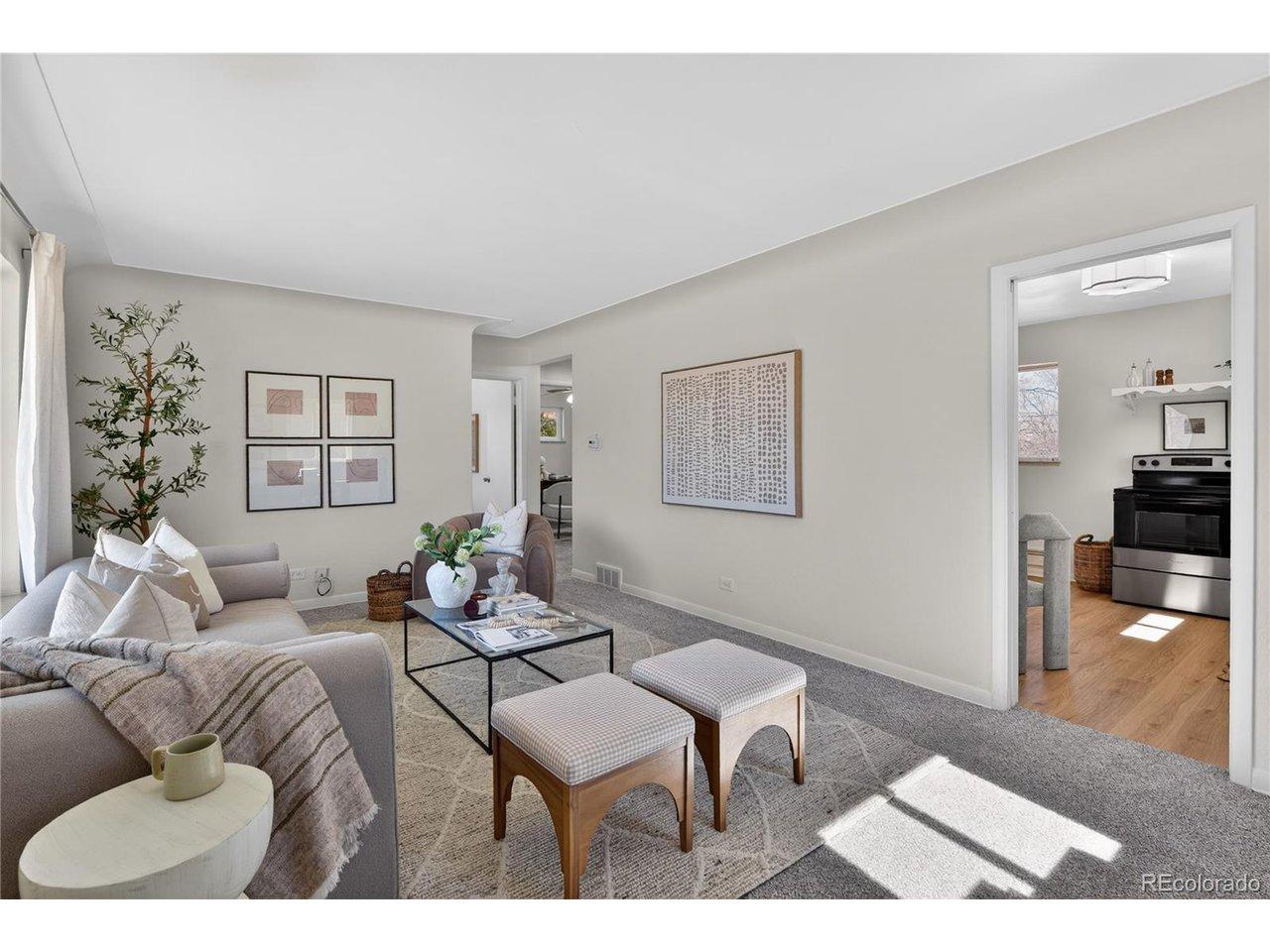 Image 3: A large, welcoming living room greets you upon entry.