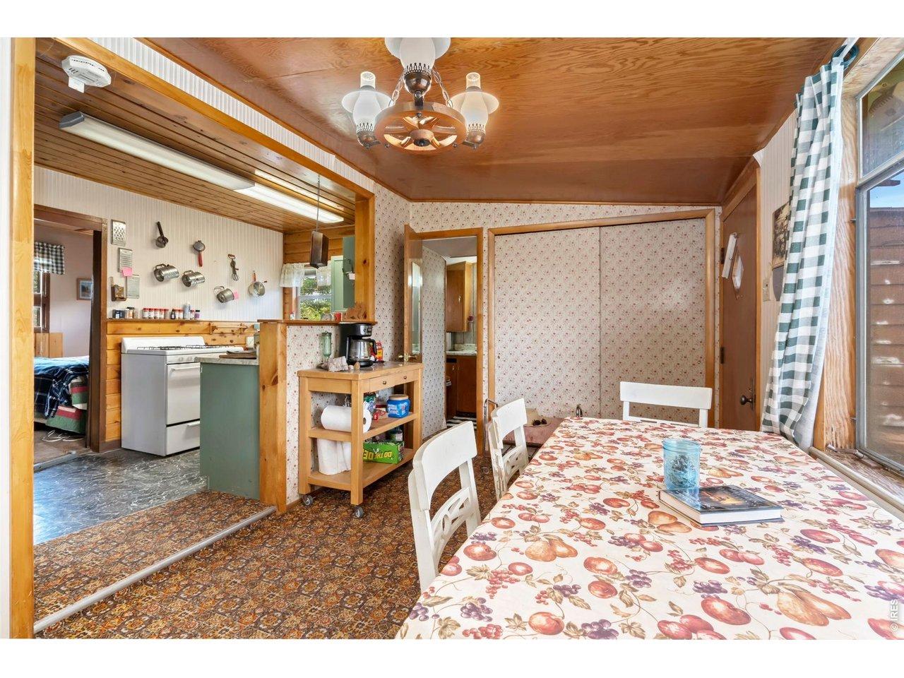 Image 4: dining area and coat closet when you first enter Image 4: dining area and coat closet when you first enter