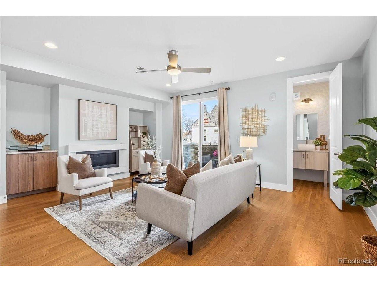 Image 3: Gas fireplace, corner nook workstation, powder room and balcony