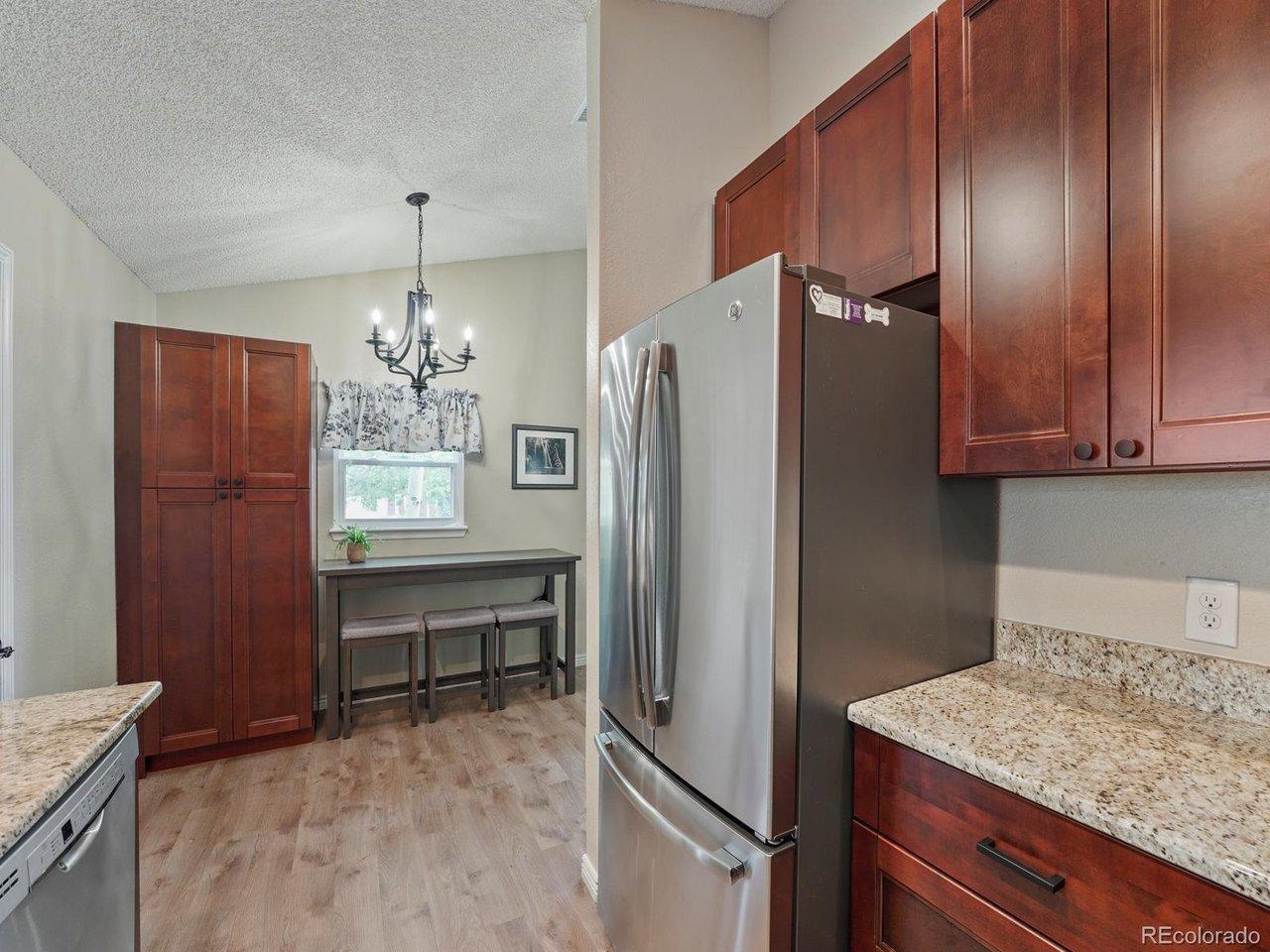 Image 4: Granite counters, updated kitchen with additional cabinetry. Room for a island or dining table too