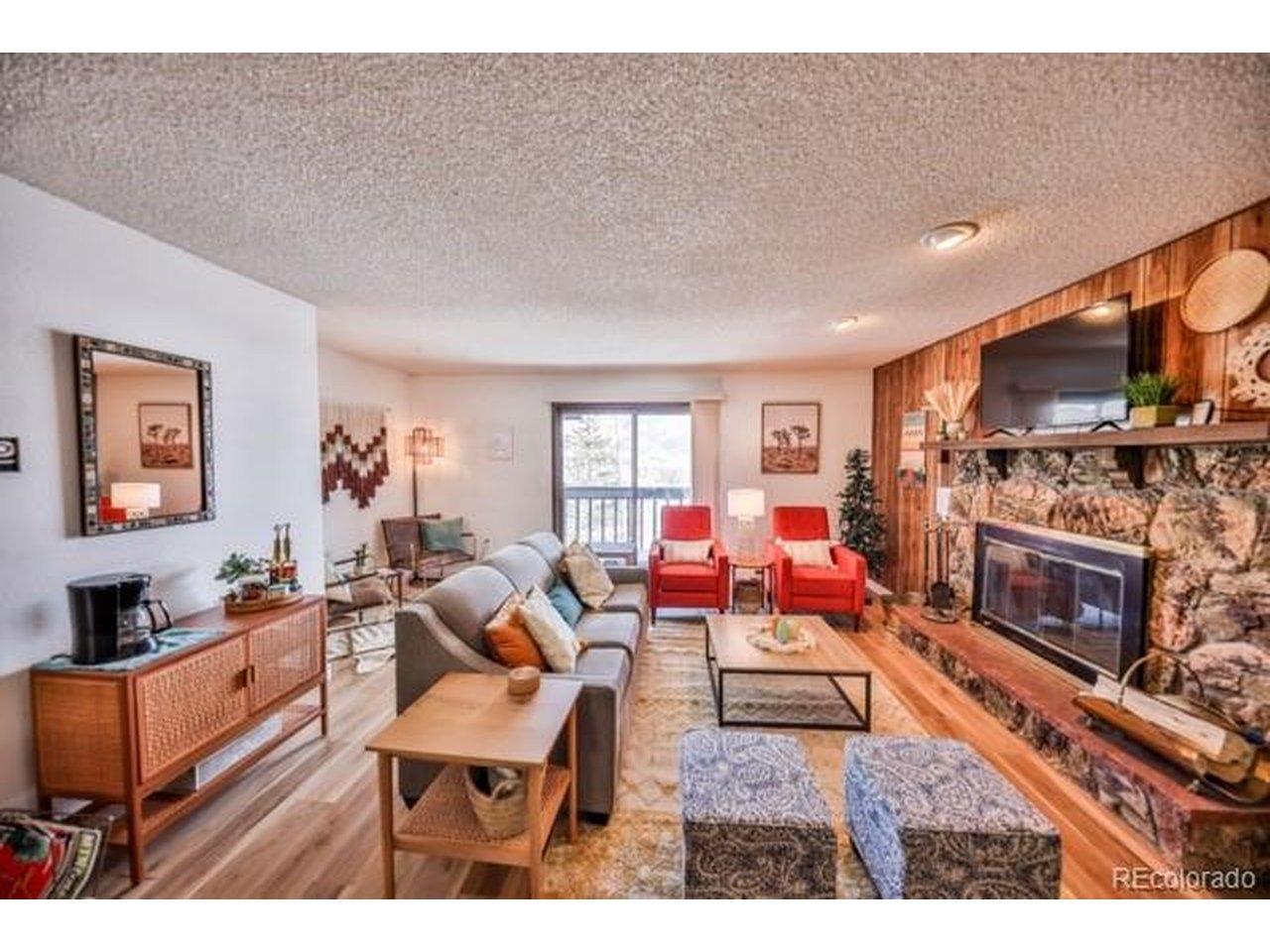 Image 3: Inviting Living area with wood buring fireplace