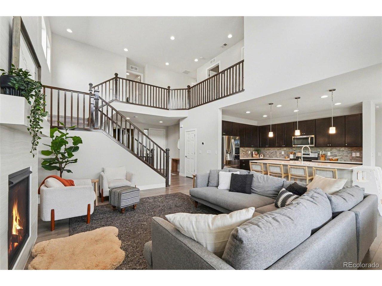 Image 2: Bright and open living space with vaulted ceilings and large windows Image 2: Bright and open living space with vaulted ceilings and large windows