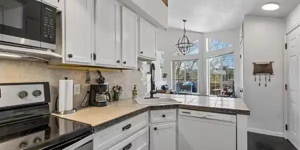 Image 3: Dishwasher was replaced with stainless steel one after photos were taken Image 3: Dishwasher was replaced with stainless steel one after photos were taken