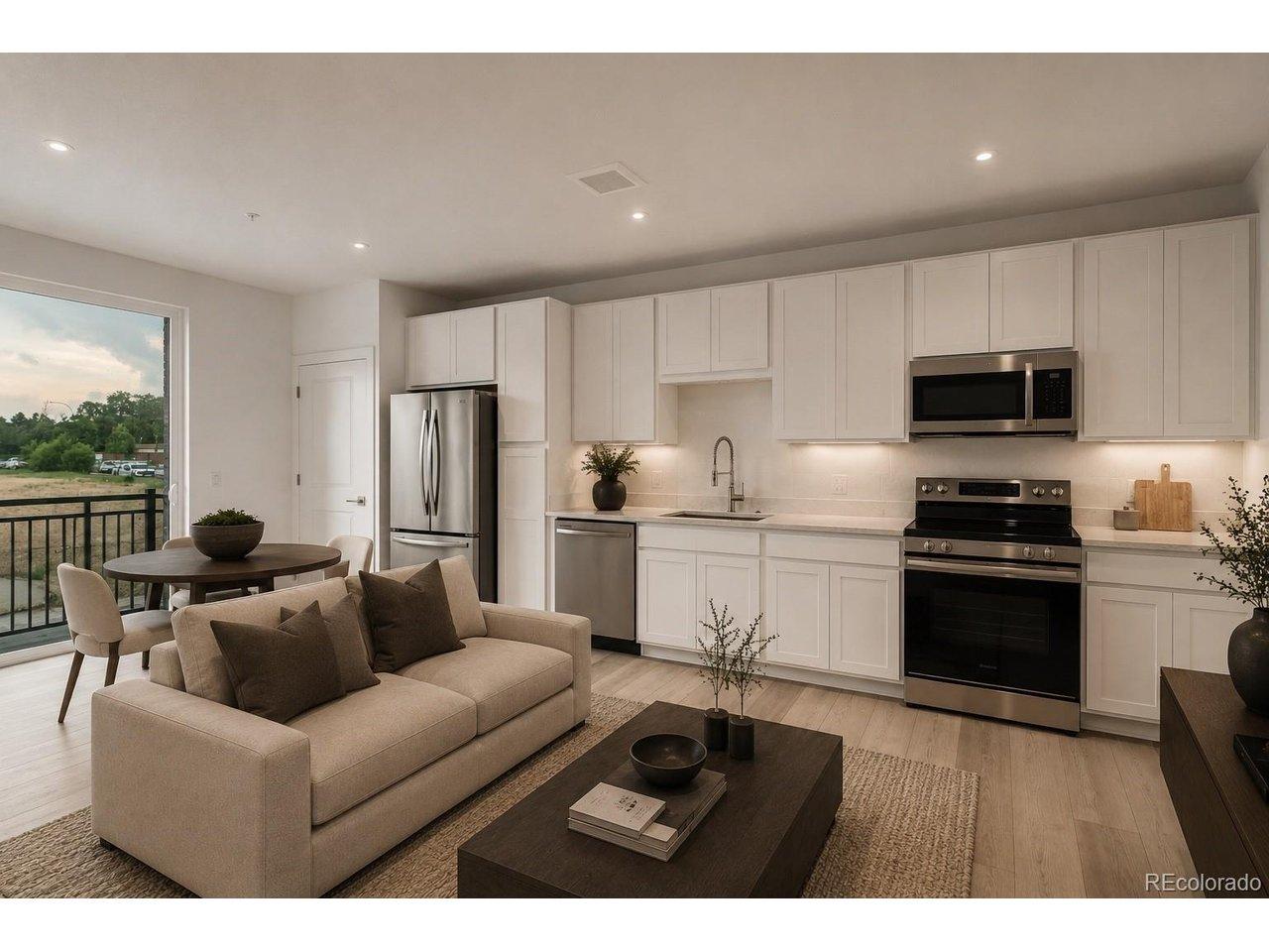 Image 3: Kitchen features white cabinetry, quartz countertops and stainless steel appliances. Refrigerator is included! *Photos are of a similar unit and features may not be exact. Image 3: Kitchen features white cabinetry, quartz countertops and stainless steel appliances. Refrigerator is included! *Photos are of a similar unit and features may not be exact.