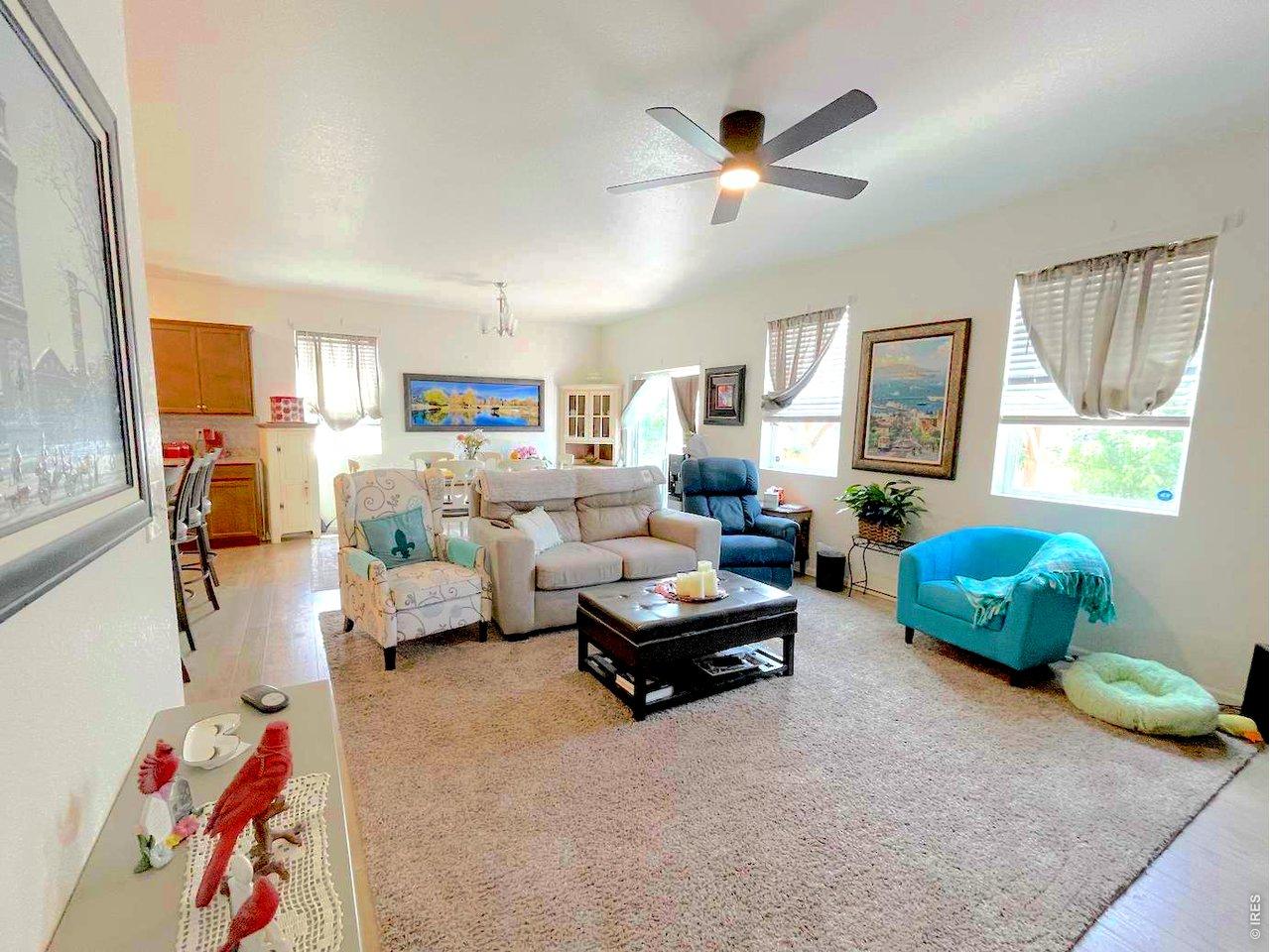 Image 3: Sunny living area has plenty of room for an L-shaped sofa and a big screen TV.