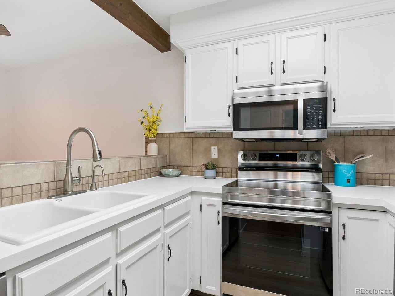 Image 4: Fresh Paint, Resurfaced Counter Tops, Tile Back Splash, Includes All Appliances, New Vinyl Floor!