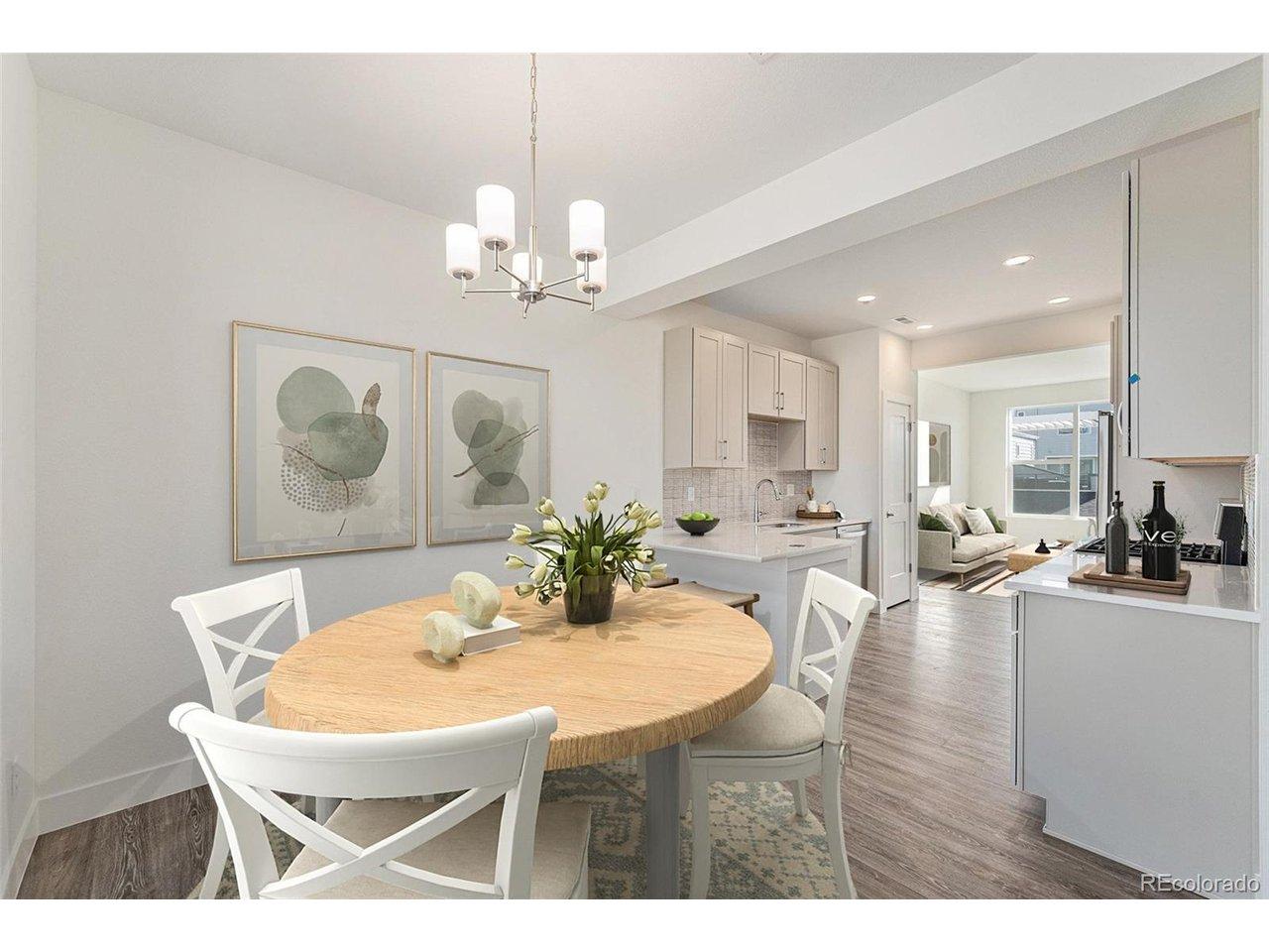 Image 1: Dining room and breakfast bar w/ covered balcony (virtually staged)