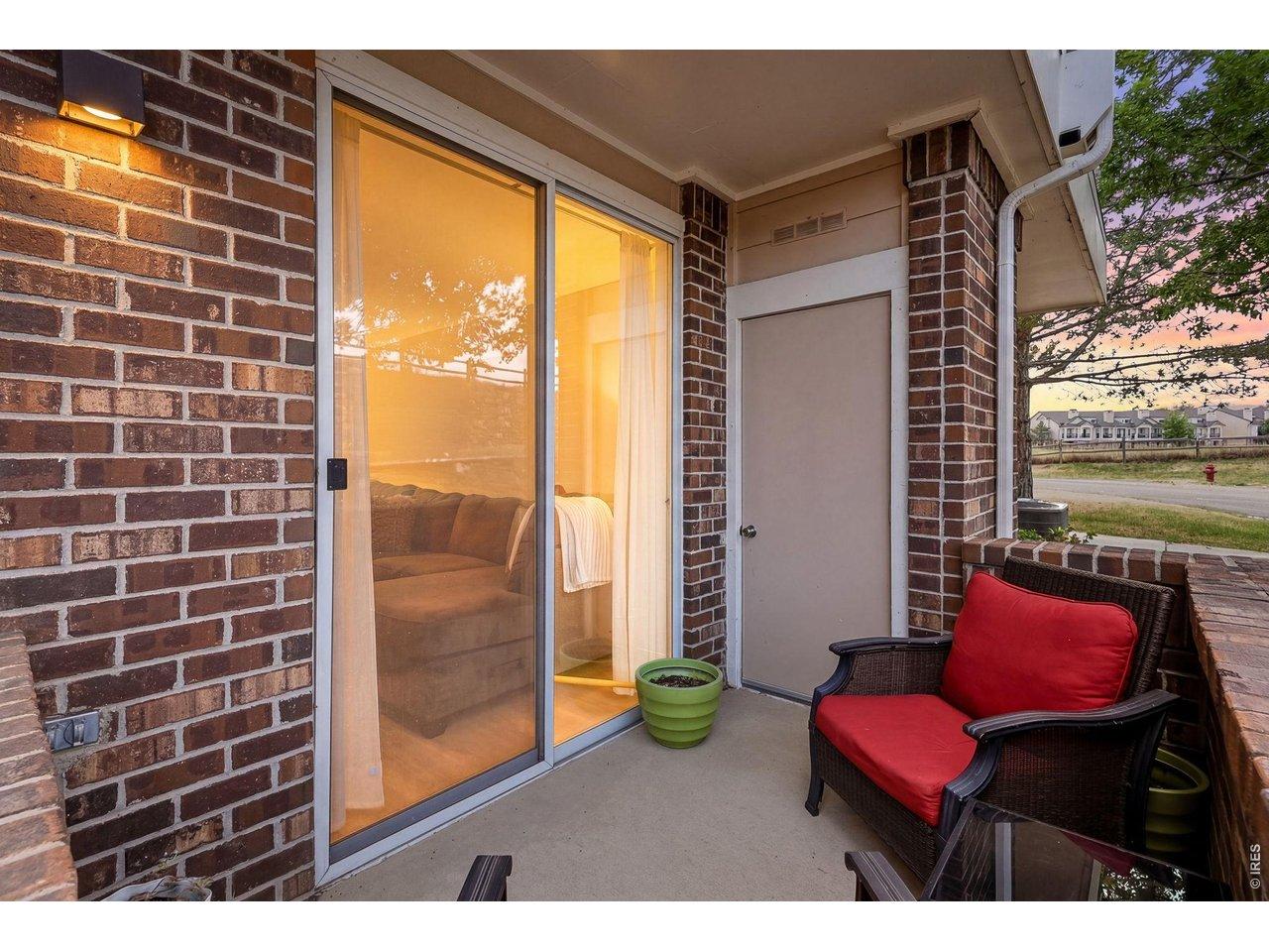 Image 2: The PRIVATE patio looks out upon the mountains and a landscaped stone wall rather than more homes or a parking lot.