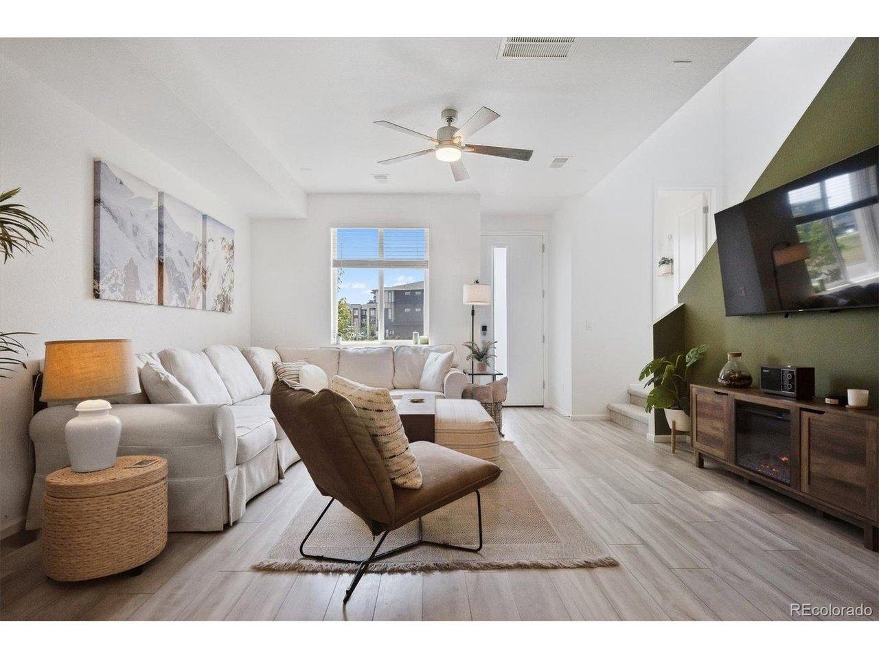 Image 1: Open living room looking out onto open space, and located on a quiet street that ends in a cul- de-sac. Image 1: Open living room looking out onto open space, and located on a quiet street that ends in a cul- de-sac.