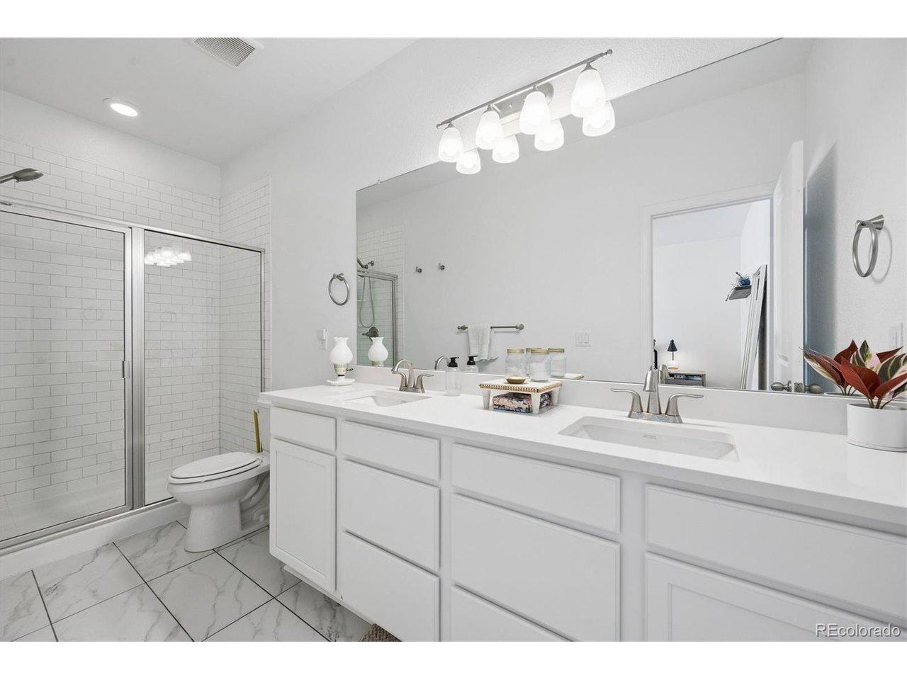 Image 4: En suite primary bath with double vanity Image 4: En suite primary bath with double vanity