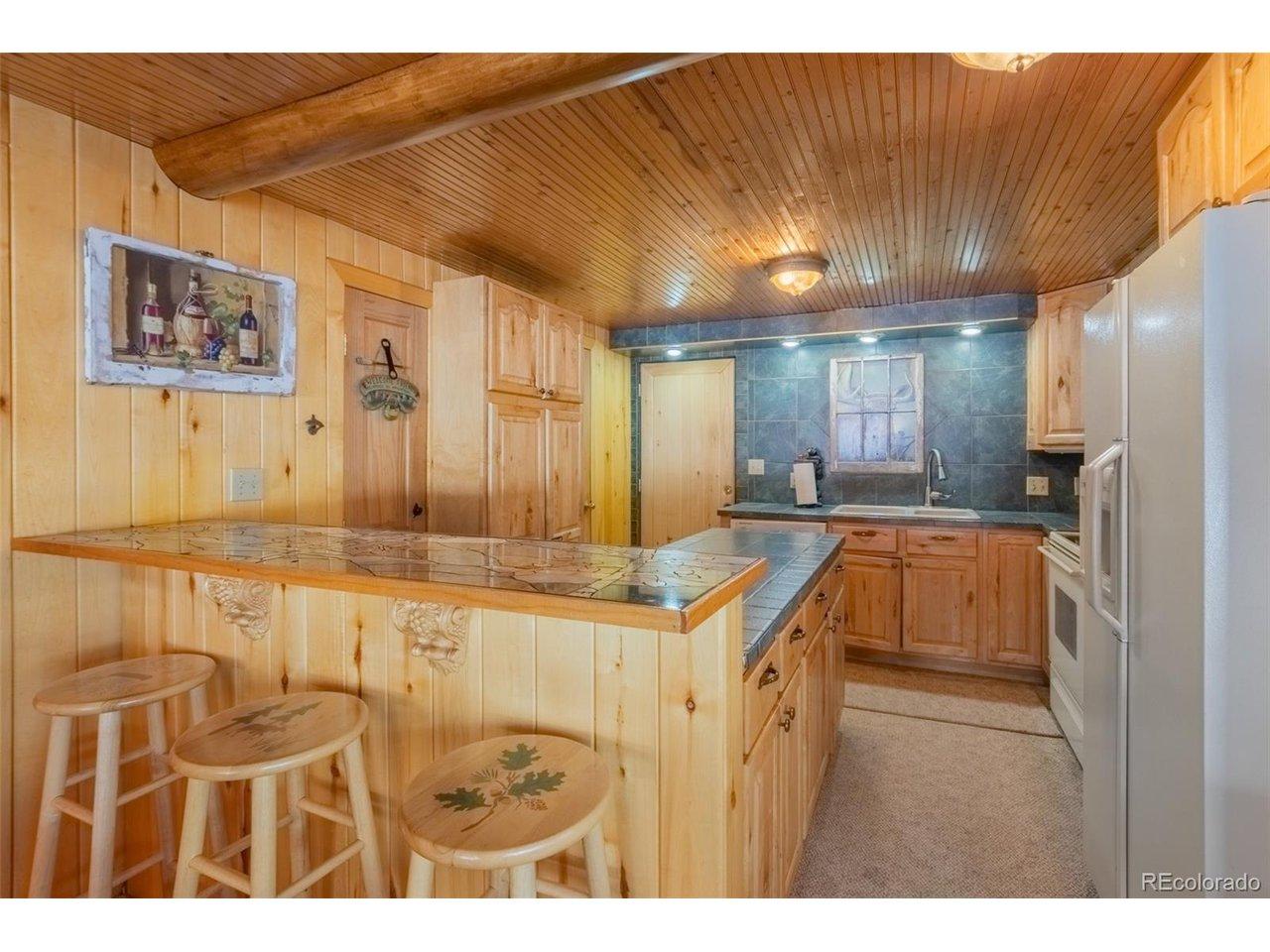 Image 4: Door leads to back porch. Image 4: Door leads to back porch.