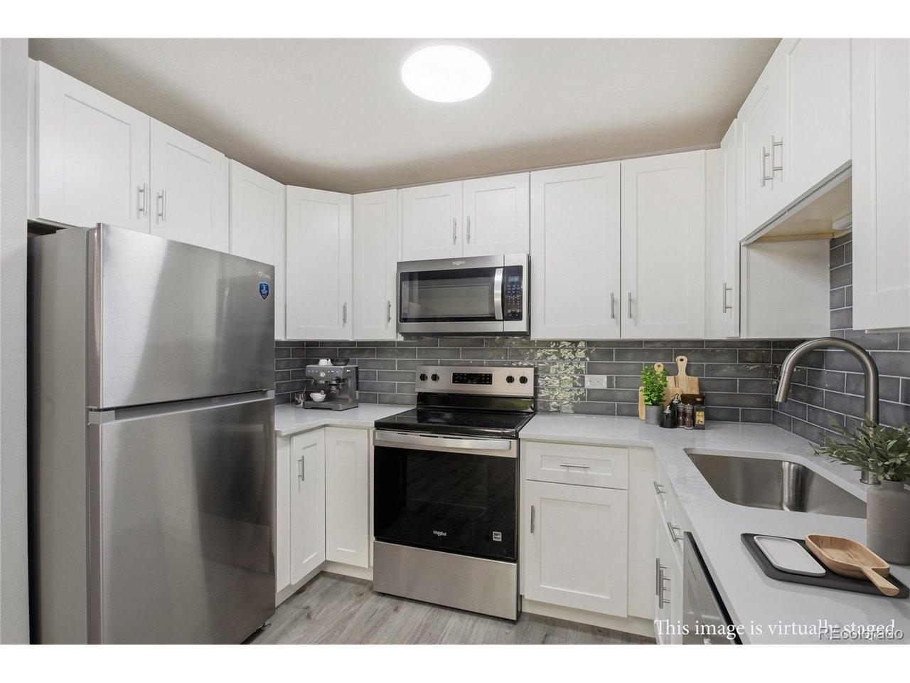 Image 1: New kitchen! Quartz countertops, soft close cabinets, New appls, subway tile backsplash. Image 1: New kitchen! Quartz countertops, soft close cabinets, New appls, subway tile backsplash.