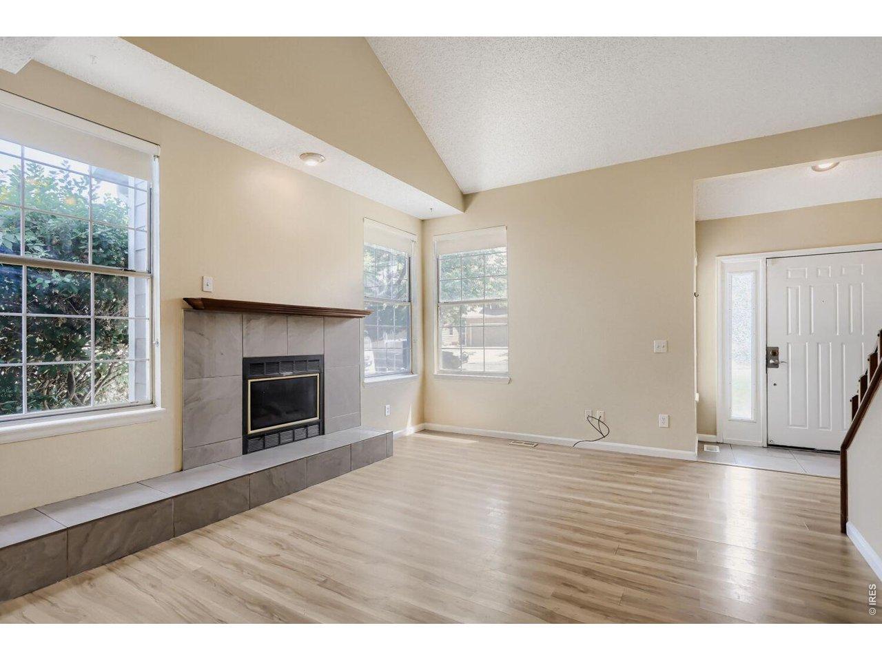 Image 2: Bright living room with gas fireplace
