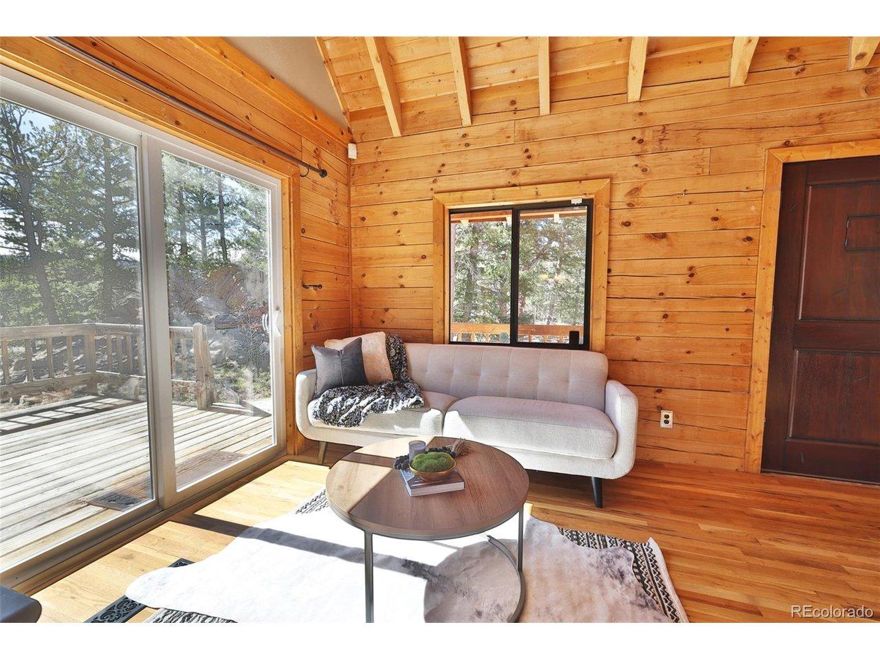 Image 3: A new sliding door opens to the wraparound porch, where you can take in stunning lake views and seamless indoor-outdoor living.