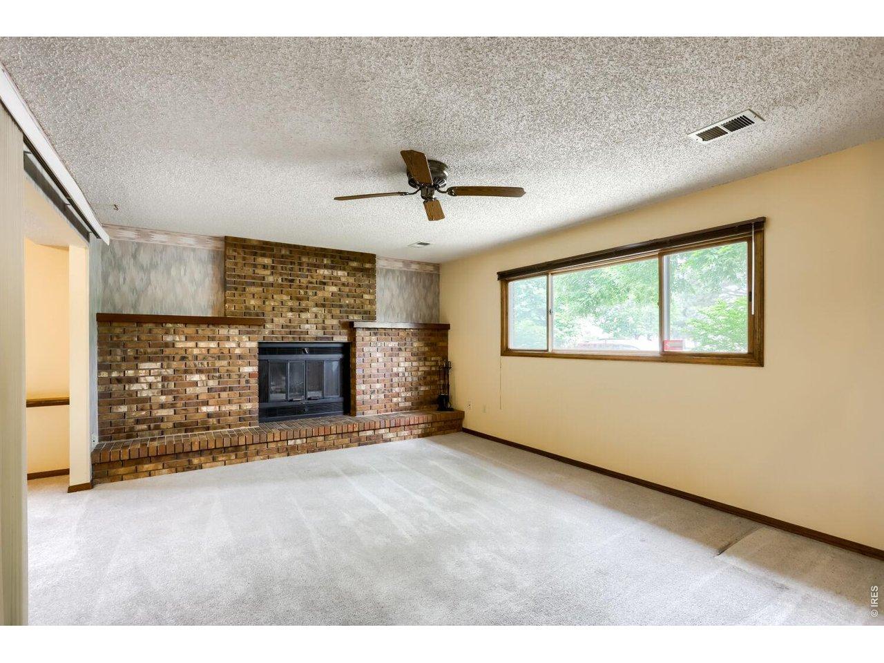 Image 2: Family room with wood-burning fireplace Image 2: Family room with wood-burning fireplace