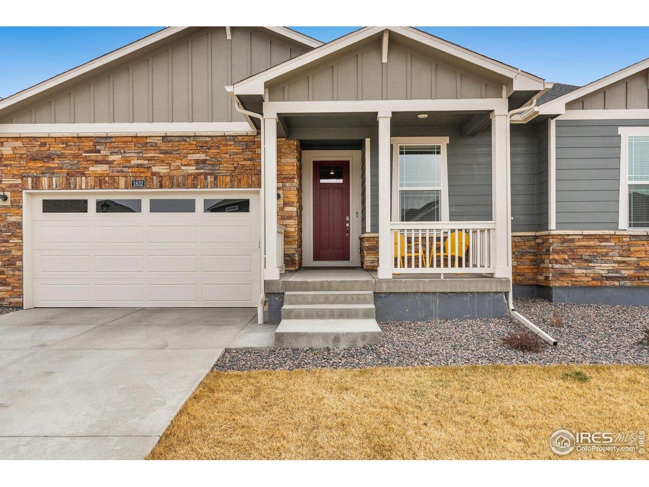 Image 2: Inviting Front Porch & 2-Car Attached Garage