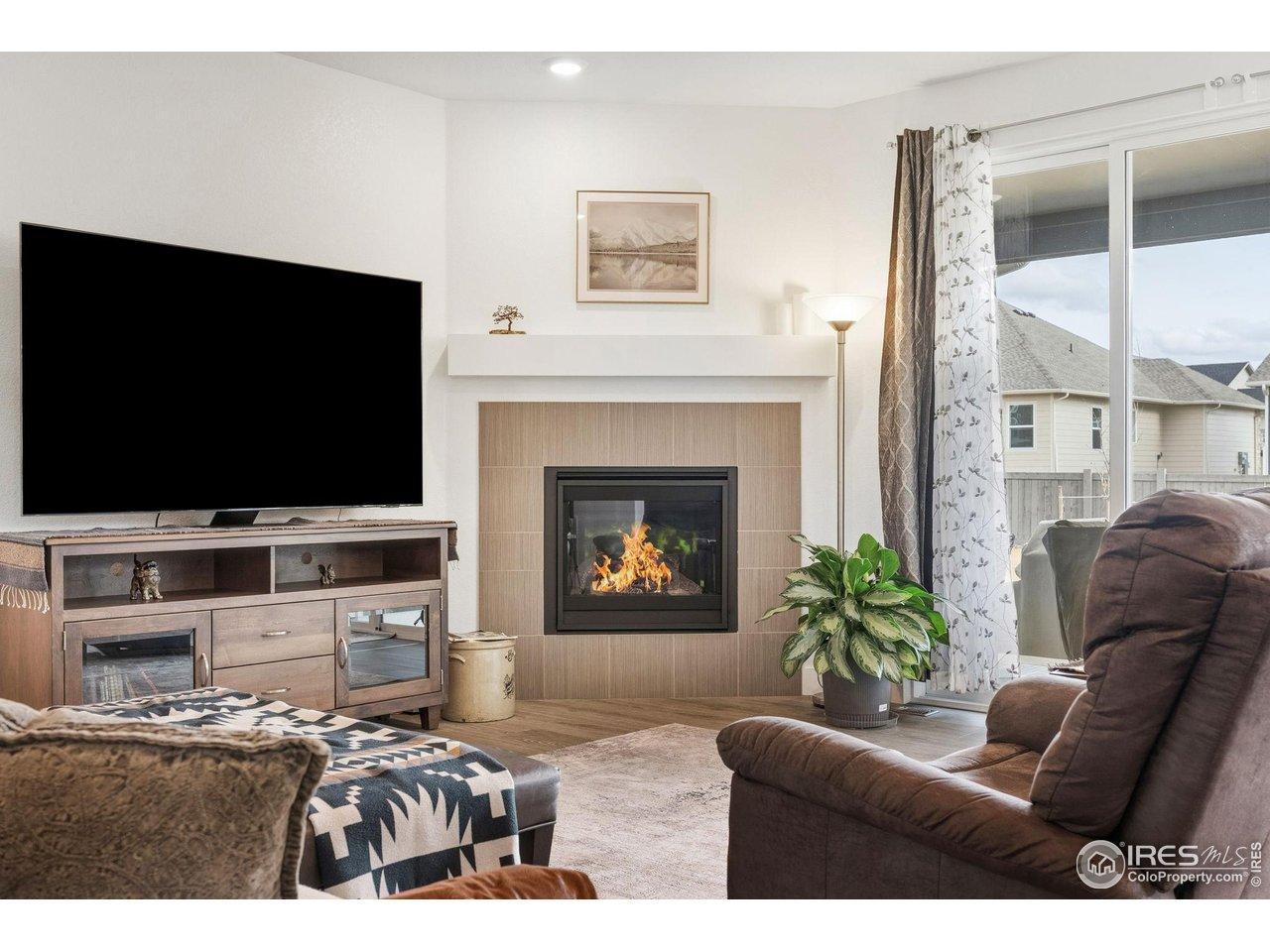 Image 3: Living Room with Cozy Gas Fireplace