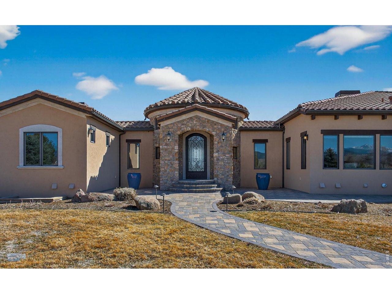 Image 3: Tile roof and stucco and brick exterior.
