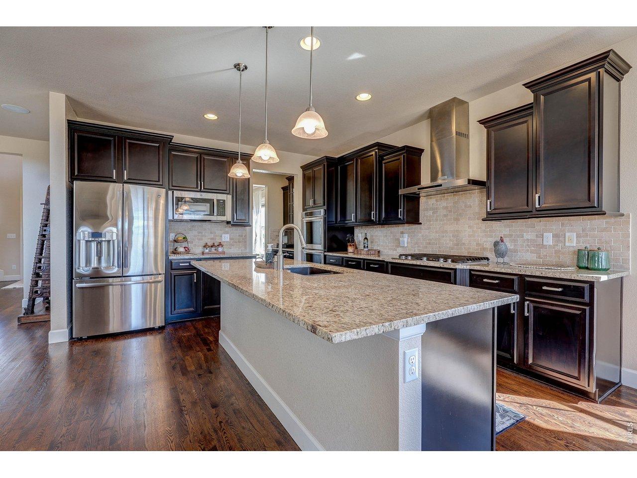 Image 3: super efficient, chef ready kitchen, GE Refrigerator & Microwave, Kitchen Aid double oven & gas cook top, dishwasher & island fits at least 4 bar stools. Image 3: super efficient, chef ready kitchen, GE Refrigerator & Microwave, Kitchen Aid double oven & gas cook top, dishwasher & island fits at least 4 bar stools.
