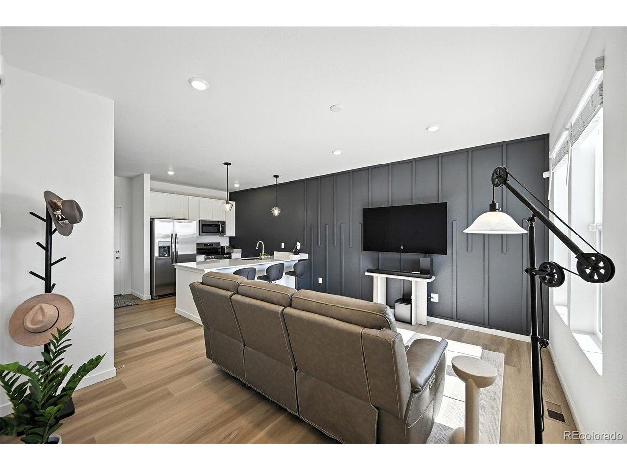 Image 4: Enter an inviting living room with a beautiful custom accent wall.