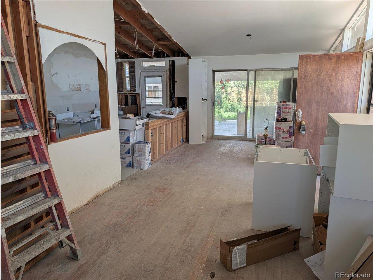 Image 3: Open main-level living/kitchen area.
