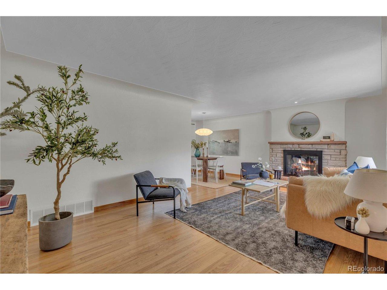 Image 3: Living room with a cozy wood burning fireplace